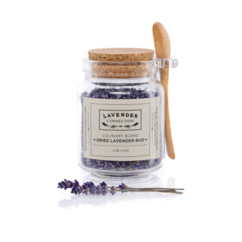 culinary lavender bud in glass jar with cork lid and wooden spoon